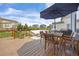 Outdoor patio with seating and dining areas, great for entertaining and relaxing outdoors at 11048 Rifle Ct, Commerce City, CO 80022