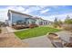 Exterior view of the backyard featuring a patio, grass area, and fire pit at 11048 Rifle Ct, Commerce City, CO 80022