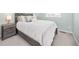 Cozy bedroom featuring a comfortable bed, soft carpet, and natural light from the window at 11048 Rifle Ct, Commerce City, CO 80022