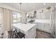Modern kitchen featuring stainless steel appliances, a large island, and stylish cabinetry at 11048 Rifle Ct, Commerce City, CO 80022