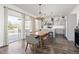 Modern kitchen and dining area with stainless steel appliances and natural light at 11048 Rifle Ct, Commerce City, CO 80022