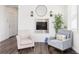 Comfortable sitting area with two armchairs, stylish decor, and serene atmosphere at 11048 Rifle Ct, Commerce City, CO 80022