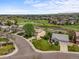 Aerial view of homes in a residential area surrounded by beautiful landscaping and green spaces and walking path at 4963 Collingswood Dr, Highlands Ranch, CO 80130