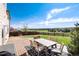 Charming backyard features a deck with outdoor furniture and a lush green lawn at 4963 Collingswood Dr, Highlands Ranch, CO 80130