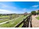 Backyard featuring a stone patio, green space, and a walking path, offering outdoor activities and relaxation with scenic views at 4963 Collingswood Dr, Highlands Ranch, CO 80130