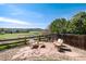 Serene backyard featuring a stone patio with outdoor seating, overlooking lush green space and a beautiful view at 4963 Collingswood Dr, Highlands Ranch, CO 80130