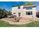 Inviting backyard featuring a deck with furniture, grass, and stone landscaping at 4963 Collingswood Dr, Highlands Ranch, CO 80130