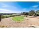 Large backyard with stone and gravel, green space, deck and lovely view at 4963 Collingswood Dr, Highlands Ranch, CO 80130