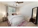 Inviting bedroom with ample natural light, cozy rug, and comfortable furnishings at 4963 Collingswood Dr, Highlands Ranch, CO 80130