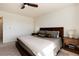 Comfortable bedroom with a large window, wood furniture, and neutral decor at 4963 Collingswood Dr, Highlands Ranch, CO 80130