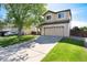 Two-story home with well manicured lawn and an attached two car garage at 4963 Collingswood Dr, Highlands Ranch, CO 80130