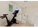 Bright hallway with exercise equipment near a staircase at 4963 Collingswood Dr, Highlands Ranch, CO 80130