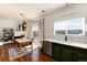Kitchen and Dining Room Area with white subway tile and stainless steel appliances at 4963 Collingswood Dr, Highlands Ranch, CO 80130