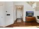Inviting living room with hardwood floors, white walls, and stairway to the second floor at 4963 Collingswood Dr, Highlands Ranch, CO 80130