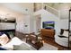 Bright living room with hardwood floors, fireplace, and stairway to the second floor at 4963 Collingswood Dr, Highlands Ranch, CO 80130