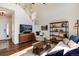 Bright living room with high ceilings, hardwood floors and modern decor at 4963 Collingswood Dr, Highlands Ranch, CO 80130