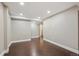 The finished basement area with wood laminate flooring and recessed lighting at 13271 Holly St # D, Thornton, CO 80241