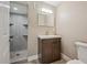 This bathroom boasts a modern vanity, toilet and tiled stand up shower, freshly remodeled at 13271 Holly St # D, Thornton, CO 80241