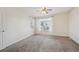 Bright bedroom features neutral walls and carpet, and a ceiling fan for added comfort at 13271 Holly St # D, Thornton, CO 80241