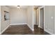 Dining area with hardwood floors located off of the living area and adjacent to a doorway at 13271 Holly St # D, Thornton, CO 80241
