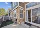 A charming exterior facade with stone accents, a sliding door, and a touch of green turf at 13271 Holly St # D, Thornton, CO 80241