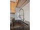 Close up of a modern kitchen sink and stainless steel faucet with tile backsplash at 13271 Holly St # D, Thornton, CO 80241