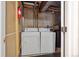 The functional laundry area offers a side-by-side washer and dryer for convenience at 13271 Holly St # D, Thornton, CO 80241