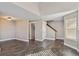 Spacious open-plan living area showcasing hardwood floors and neutral wall colors, offering a blank canvas at 13271 Holly St # D, Thornton, CO 80241