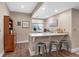 Finished basement with a bar, seating, and built-in cabinets for storage and entertainment at 18926 W 93Rd Ave, Arvada, CO 80007