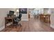 Basement office space with a desk and adjacent kitchenette featuring barstool seating at 18926 W 93Rd Ave, Arvada, CO 80007