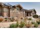 Beautiful clubhouse exterior with stone accents and attractive landscaping at 18926 W 93Rd Ave, Arvada, CO 80007