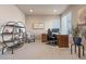Bright office featuring a traditional wooden desk and shelving with ample natural light and cozy decor at 18926 W 93Rd Ave, Arvada, CO 80007