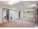 Spacious unfinished basement with carpeted floors and stairs access at 4591 S Pennsylvania St, Englewood, CO 80113