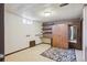 Spacious basement featuring carpeted floors, shelving unit and built in desk at 4591 S Pennsylvania St, Englewood, CO 80113