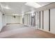 Unfinished basement with large open floor plan and carpeted floors at 4591 S Pennsylvania St, Englewood, CO 80113