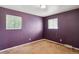 Bedroom with purple painted walls and carpeted floor at 4591 S Pennsylvania St, Englewood, CO 80113