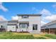Backyard of a home with a patio, lush lawn, and established landscaping at 2430 S Halifax Way, Aurora, CO 80013