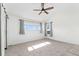 Bright main bedroom featuring plush carpeting, vaulted ceilings, and ample natural light at 2430 S Halifax Way, Aurora, CO 80013