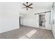 Bright, airy primary bedroom with en-suite bath featuring modern fixtures and barn-door closure at 2430 S Halifax Way, Aurora, CO 80013
