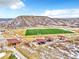 Scenic aerial view of a community park with a sports field, picnic pavilions, and a hillside backdrop at 631 Felicity Loop, Castle Rock, CO 80109