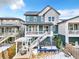 Large backyard features a deck, pergola, trampoline, and patio set, ideal for outdoor living at 631 Felicity Loop, Castle Rock, CO 80109