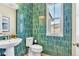 Bright half bathroom with vanity sink and commode at 631 Felicity Loop, Castle Rock, CO 80109