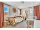 Unique bedroom featuring a daybed, decorative mirror, and eclectic decor, perfect for relaxation at 631 Felicity Loop, Castle Rock, CO 80109