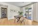 Bright dining area with a wood table, patio access and stylish decor at 631 Felicity Loop, Castle Rock, CO 80109