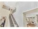 Elegant foyer featuring soaring ceilings, a staircase with iron railings, and an open view to the living room at 631 Felicity Loop, Castle Rock, CO 80109