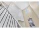 Bright foyer showcasing high ceilings, a staircase with decorative iron railings, and modern architectural details at 631 Felicity Loop, Castle Rock, CO 80109