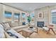 Cozy living room featuring a fireplace and sectional couch with views at 631 Felicity Loop, Castle Rock, CO 80109