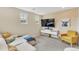 Comfortable living room with a large TV, modern decor, and cozy seating, perfect for relaxation at 631 Felicity Loop, Castle Rock, CO 80109