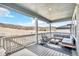 Covered patio with comfortable seating and scenic views of the rolling hills and natural landscape at 631 Felicity Loop, Castle Rock, CO 80109