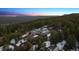 Aerial view of modern home with scenic overlook in the distance at 2536 N State Highway 67, Sedalia, CO 80135